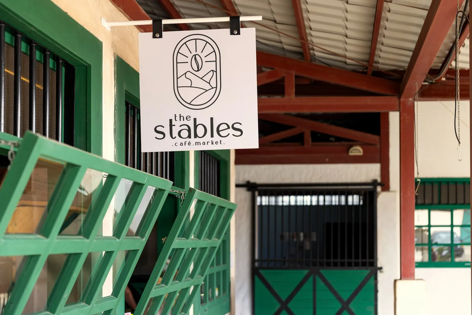 The Stables Café & Market sign at RISE Costa Rica Town Square